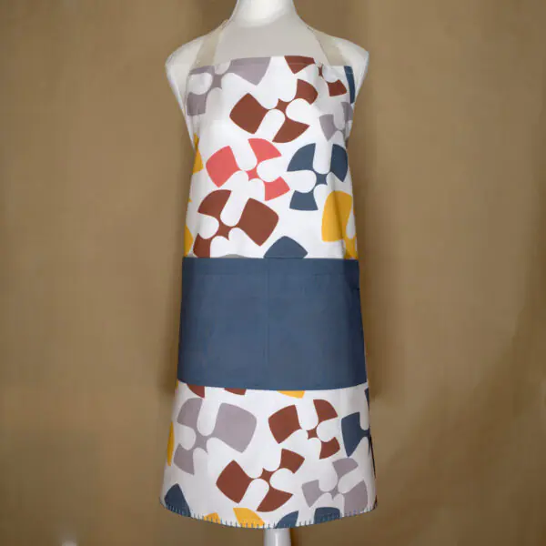flock and flutter design apron in grey on mannequin from hem and tassel
