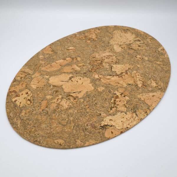 graphic oval design cork placemat seen as single from hem and tassel