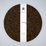matt black design set of two cork placemats with bandroll from hem and tassel
