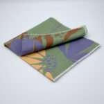 Pollen Up design dinner Napkin in purple and buff flower with table runner in pollen up design in buff