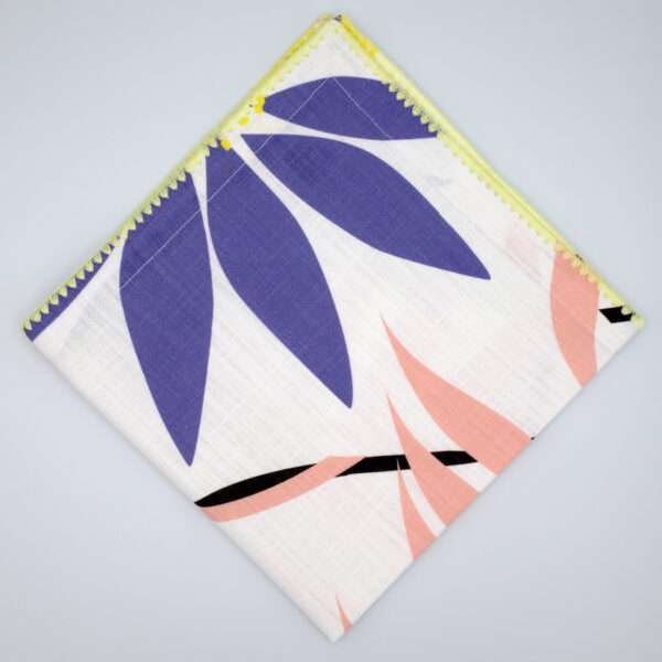 pollen up design dinner napkin in yellow flat folded from hem and tassel