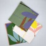pollen up design three dinner napkins fanned from hem and tassel