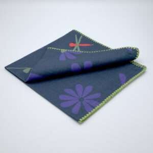 shy dragonfly hiding among flowers. Design dinner napkin in oil folded from hem and tassel