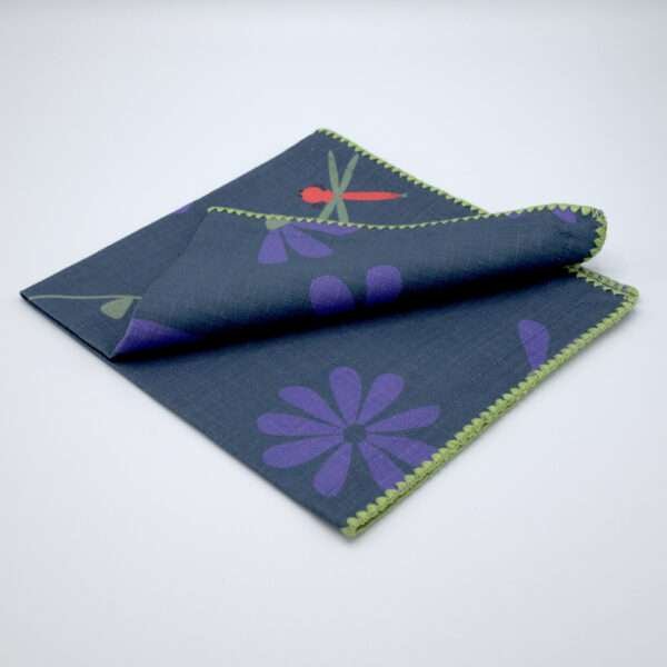 shy dragonfly hiding among flowers. Design dinner napkin in oil folded from hem and tassel