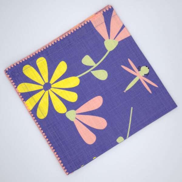 shy dragonfly design dinner napkin in purple flat folded from hem and tassel