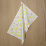 shy dragonfly design hanging tea towel in yellow blush from hem and tassel