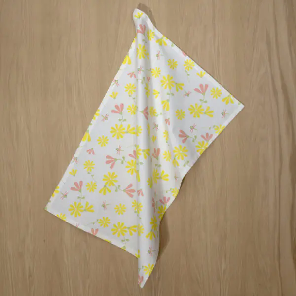 shy dragonfly design hanging tea towel in yellow blush from hem and tassel