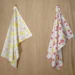 shy dragonfly design two hanging tea towels with yellow from hem and tassel