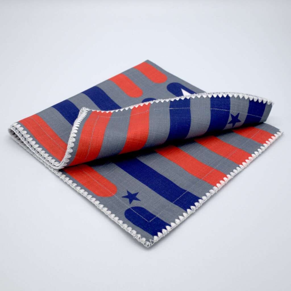 stars and stripes design dinner napkin folded from hem and tassel