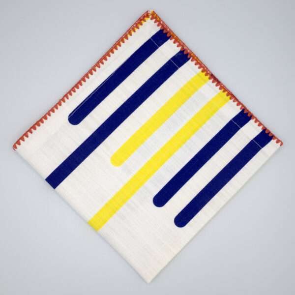 yellow piano design dinner napkin flat folded from hem and tassel
