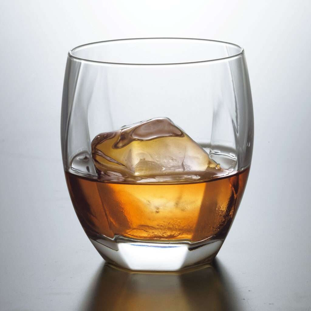 old fashioned whiskey glass with multiple facets showing clarity of glass