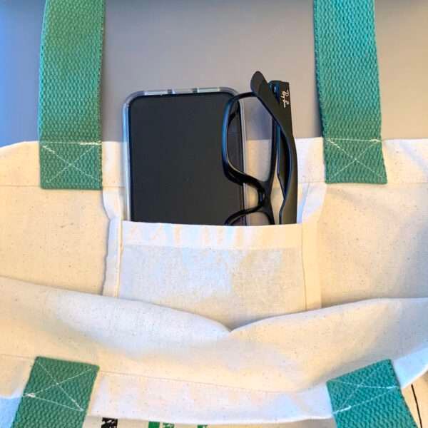 Showing convenient inner pocket of canvas shopping tote bag