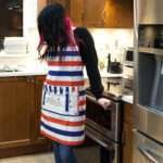 Apron to salute Stars and Stripes design on woman in kitchen by Hem and Tassel