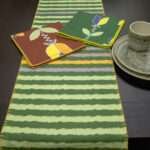 Melon rough stripes table runner with lip Tulip dinner napkins LS from hem and tassel