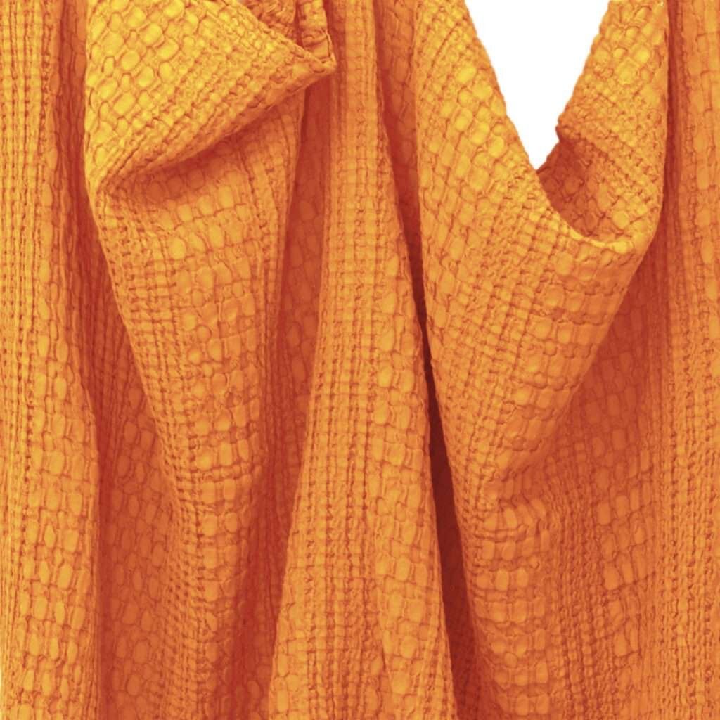 Pure cotton, dual waffle throw in sunset orange color