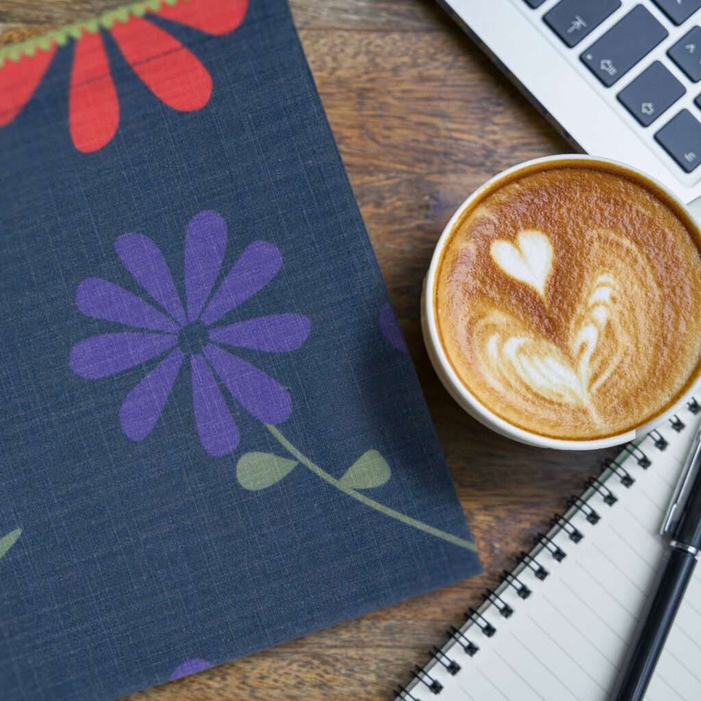 Shy Dragonfly design dinner napkin in Oil with coffee cup and computer