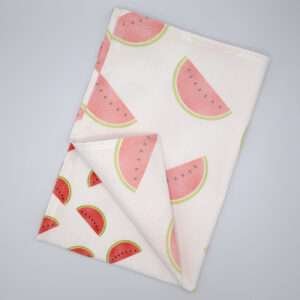 Faded melon design tea towel flat folded from hem and tassel
