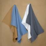 jekyll and hyde four tea towels hanging on wall shown together from hem and tassel