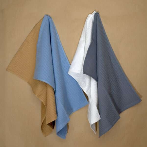 jekyll and hyde four tea towels hanging on wall shown together from hem and tassel