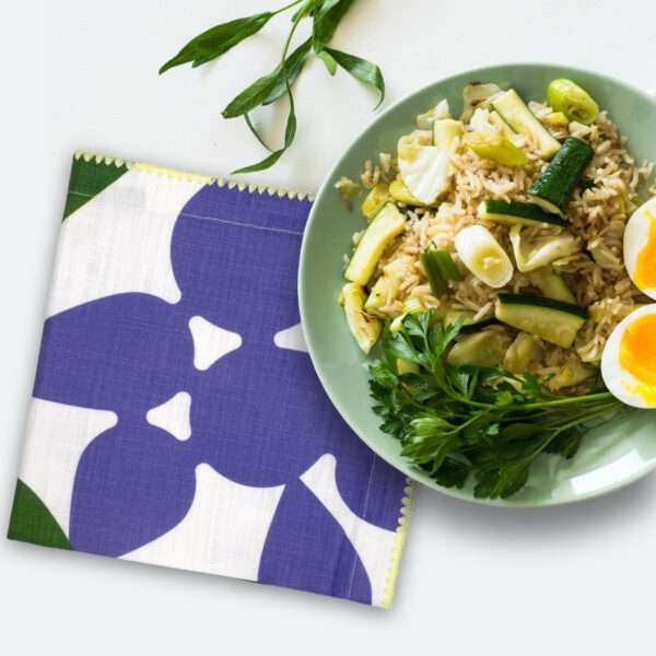 celebration dinner napkin in purple with a meal plate from hem and tassel