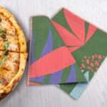 pollen up dinner napkin in pink with pizza