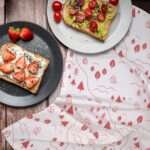 Tiny countryside tea towel with food on outdoor table