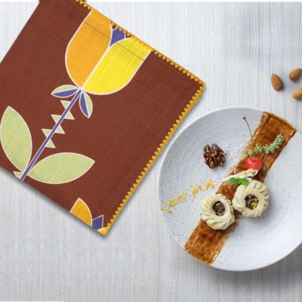 art deco lip tulip design dinner napkin on table with desert plate