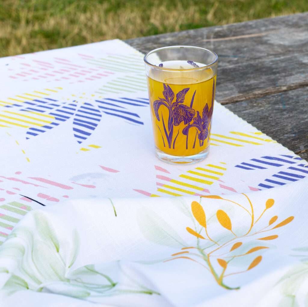 7oz iris glass on a park table with juice inside