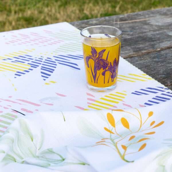 7oz iris glass on a park table with juice inside