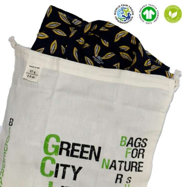 Large Green City Life produce bag as garment wash bag with delicate shirt insidefrom hem and tassel