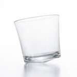Tottering whiskey glass empty from hem and tassel