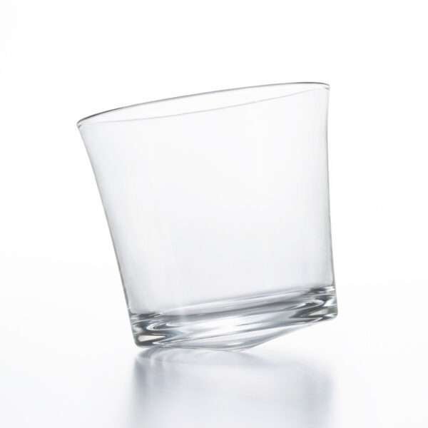 Tottering whiskey glass empty from hem and tassel
