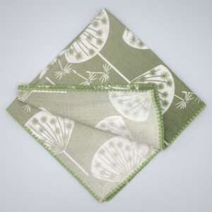 dandelions design green dinner napkin top view by DTE from Hem And Tassel