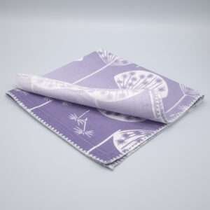 dandelions design purple dinner napkin folded by DTE from Hem And Tassel