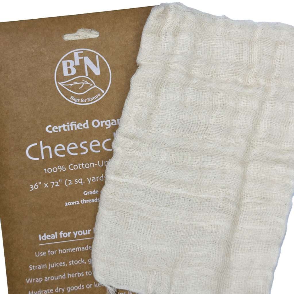 one pack of organic cotton Cheesecloth and cheesecloth fabric shown unpackedfrom hem and tassel
