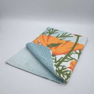 poppies design towel folded front view by DTE from Hem And Tassel