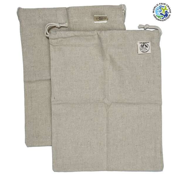 two hemp and cotton produce bags shwon opened upfrom hem and tassel